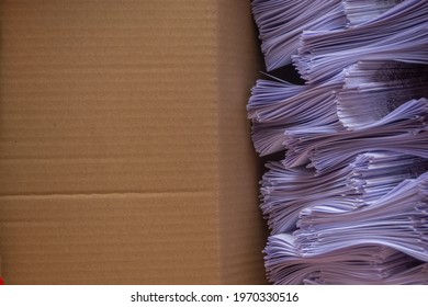 A box filled with paper sheets