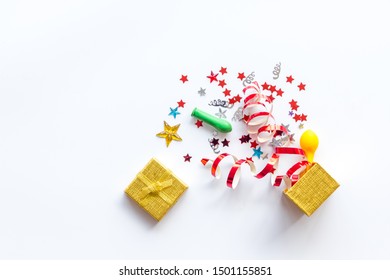 Box filled with party objects on white background top view