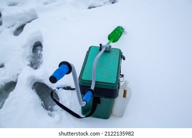 Box With Fishing Tackle And Ice Drill