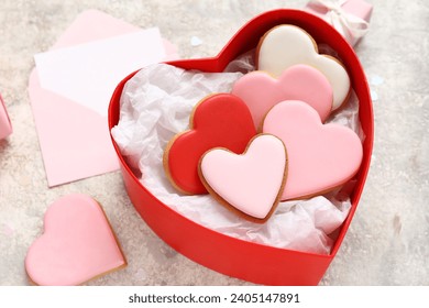 Box with heart-shaped cookies on grey grunge background, closeup. Valentine's Day celebration - Powered by Shutterstock