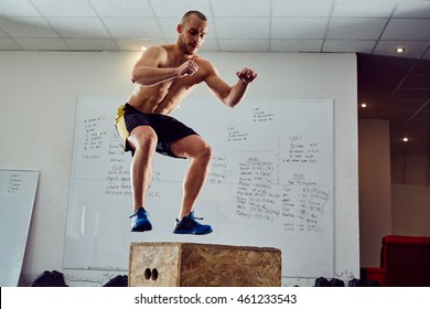 Box Jump Exercise - Young Man Doing Functional Workout At The Gym