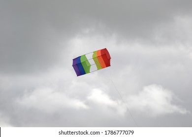 Box Kite On Dark Clouds