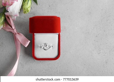 Box With Luxury Engagement Ring On Grey Background, Top View