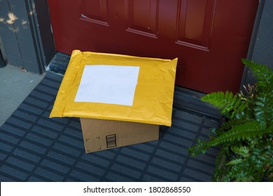 A Box And A Mailer On A Doorstep, Online Order Home Delivery Concept