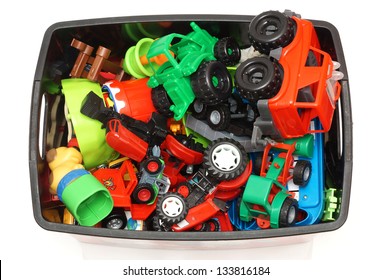 Box With Many Toys On White Background