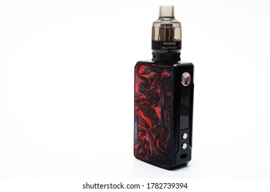 Box mod Drag 2 refresh edition with Pnp tank on a white background. Voopoo drag 2. Box mod packing, black-red in macro and in hands. July 2020. Los Angeles, USA