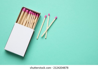 Box with new matchsticks on color background
