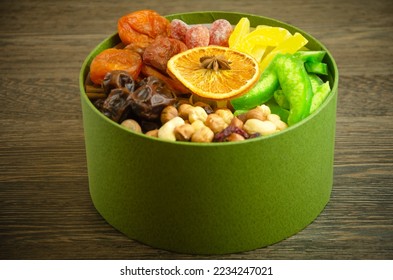 in the box nuts, dried fruits and candied fruits, a useful gift - Shutterstock ID 2234247021