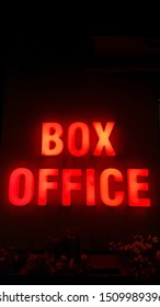 BOX OFFICE SIGN With Red Light On A Wall At Night