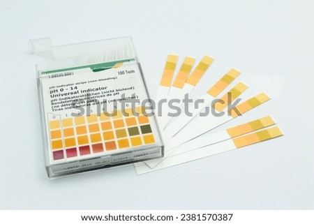 A box of pH indicator test strips, isolated on white background.