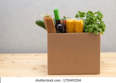 Box With Products In The Kitchen Pasta, A Bottle Of Wine, Vegetables And Fruits, Cereals. Home Delivery.