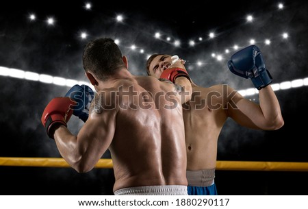 Box professional match on dark smoke background. Mixed media