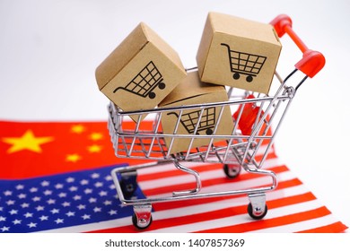 Box With Shopping Cart Logo And The USA America And China Flag : Import Export Shopping Online Or ECommerce Delivery Service Store Product Shipping, Trade, Supplier Concept.

