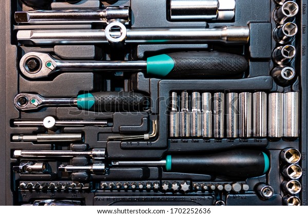 Box with special tools in car repair shop, closeup
- image