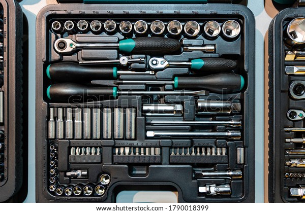 Box with special tools in car repair shop, closeup\
- image