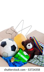 A Box Of Unwanted Stuff Ready For A Garage Sale Or To Donate To A Charitable Organization.  Generic Teddy Bear.  Shot On White Background.