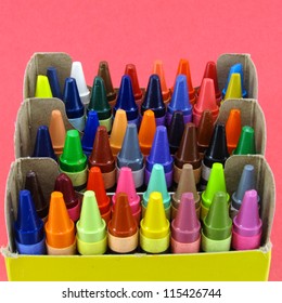 Box of vivid and colorful crayons.