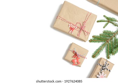 box wrapped in brown kraft paper and tied with rope, gift on white background, top view, copy space