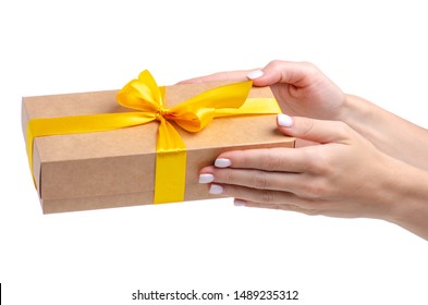 Box With Yellow Ribbon Bow Gift In Hand On White Background Isolation