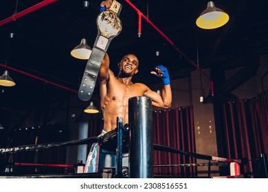 Boxer with Champion belt celebrating flawless victory. Boxing fighters training at gym	 - Powered by Shutterstock