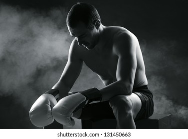 Boxer man concentrating on dark background - Powered by Shutterstock