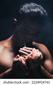 Boxer Man, Fight And Blood Of A Boxing Fighter With Cigarette After Training Accident And A Injury. Smoking Fitness, Workout Exercise And Wellness Athlete Smoke With A Hand Bandage From Sport