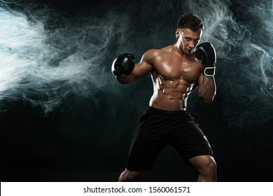 Boxer, man fighting or posing in gloves on black background. Fitness and boxing concept. Individual sports recreation. - Powered by Shutterstock