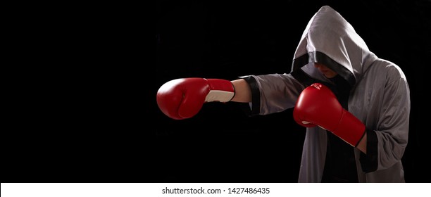 Boxer with red boxing glove doing shadow boxing.  - Powered by Shutterstock