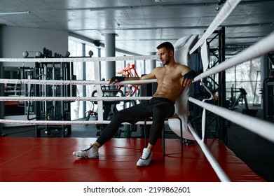 Boxer resting sit in boxer ring - Powered by Shutterstock