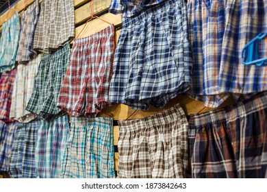 Boxer shorts of various colors and plaid patterns for sale at a tiangge, boutique or flea market. Cheap wholesale Men's underwear.