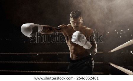Boxer with tattoos throws a punch in intense lighting on a stylized 3D boxing ring. Concept of athletic performance, health and lifestyle