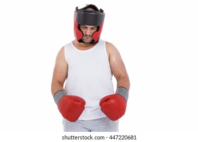 Boxer wearing head protector and gloves isolated on white background - Powered by Shutterstock