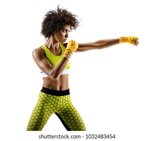 Boxer Woman Making Direct Hit. Photo Of Sporty African Woman During Boxing On White Background. Dynamic Movement. Side View