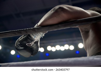 boxer's hand on the ring rope