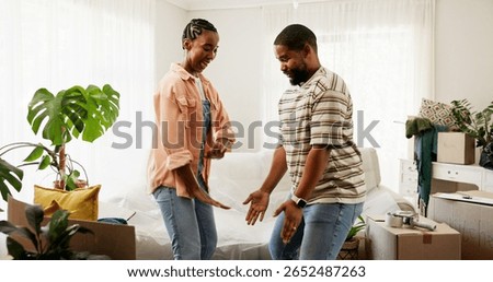 Boxes, dance and moving house with black couple in living room for celebration or relocation. Having fun, music and success with happy people in home together for property or real estate investment