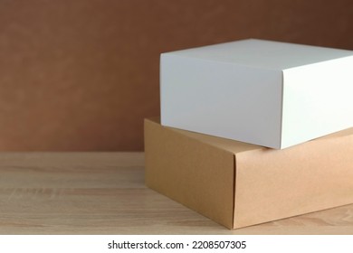 Boxes on a wooden surface, home delivery - Shutterstock ID 2208507305