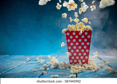 Boxes of popcorn on blue background, close-up. - Powered by Shutterstock