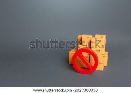 Boxes and prohibition symbol NO. Trade wars. A ban on the import of goods. Impossibility of transportation, oversupply. Shortage of goods. Sanctions and embargoes. Confiscation of contraband.