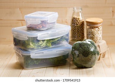 Boxes With Raw Vegetables For Stocking Up, Home Food Storage In Plastic Containers, On Wooden Background