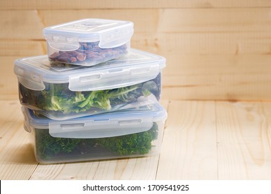 Boxes With Raw Vegetables For Stocking Up, Home Food Storage In Plastic Containers, On Wooden Background