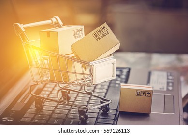 Boxes in a trolley on a laptop keyboard. Ideas about online shopping, online shopping is a form of electronic commerce that allows consumers to directly buy goods from a seller over the internet.