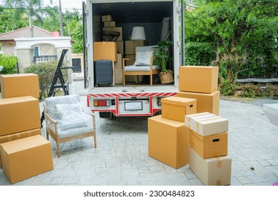 Boxes waiting to be moved into a new home,New home,Moving house day and real estate concept. - Shutterstock ID 2300484823