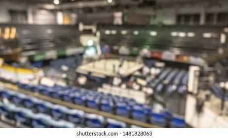 Boxing Arena With Box Ring Blur Background For Muay Thai Combat Sport Fight Match Battle With Blurry Stage And Empty Stadium Hall For Audience From Top View