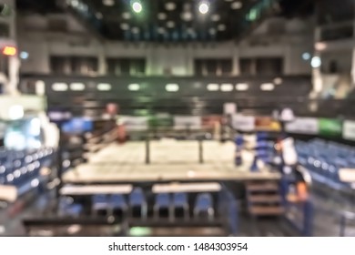 Boxing Arena With Box Ring Blur Background For Muay Thai Combat Sport Fight Match Battle With Blurry Stage And Empty Stadium Hall For Audience From Top View