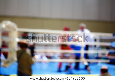 Boxing bout theme creative abstract blur background with bokeh effect. Not sharp picture as a background, wallpaper sport battle boxers in the ring