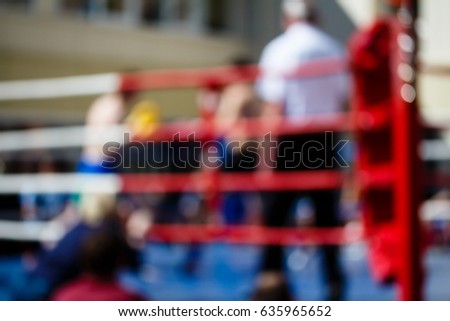 Boxing bout theme creative abstract blur background with bokeh effect. Not sharp picture as a background, wallpaper sport battle boxers in the ring