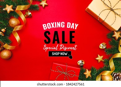 Boxing Day Sale With Christmas Present And Xmas Decoration On Red Background