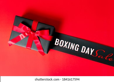 Boxing Day Sale Concept Christmas Gift Box On Red Background, Top View