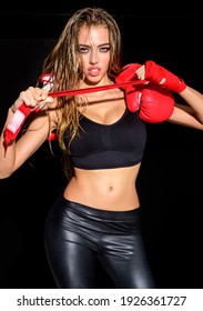 Boxing girl. Sexy sportswoman preparing to workout. Fitness and healthy lifestyle. Workout. Sport woman with athletic body.
