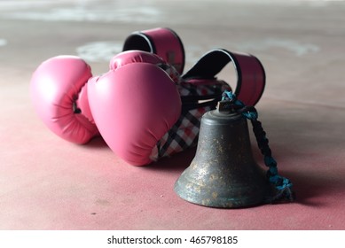 Boxing Glove Series : Pink Boxing Gloves On The Ring Next To Old Brass Bell